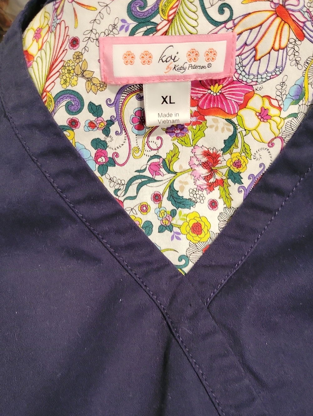 koi Floral-Lined Navy Scrub Top
